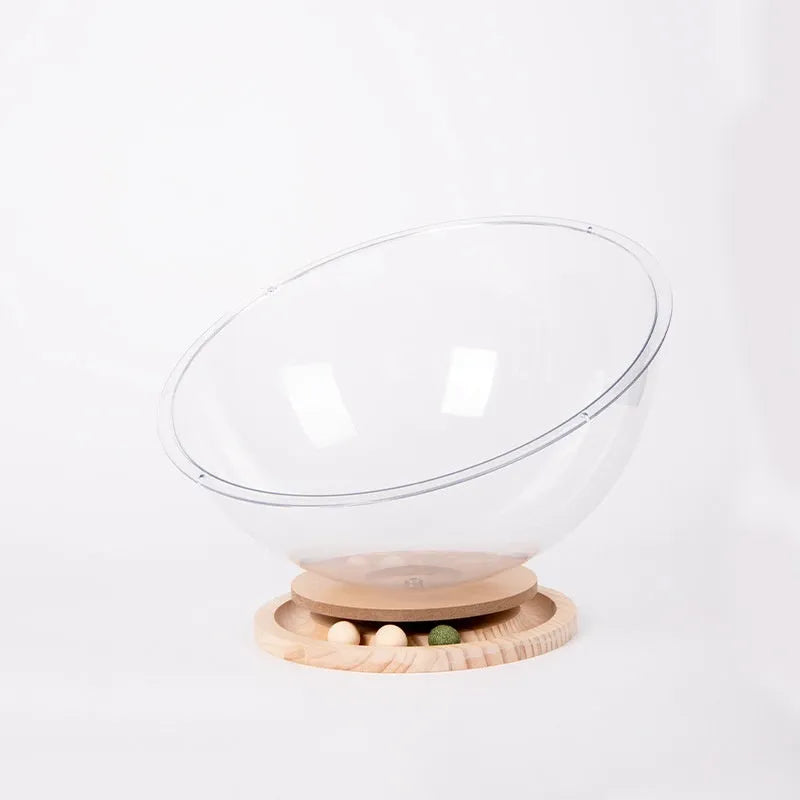 Transparent acrylic space capsule-shaped cat bed on a turntable base.