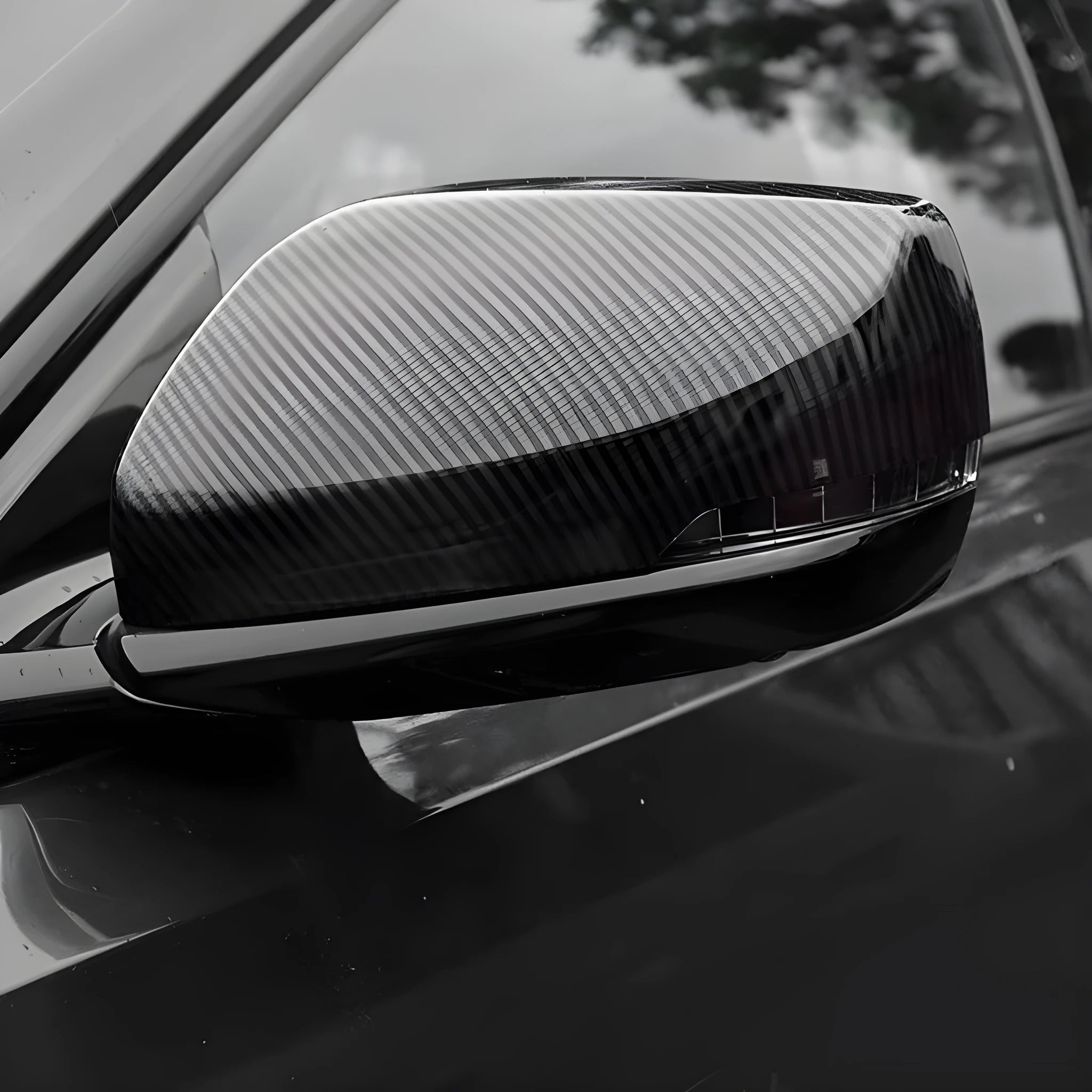 Set of ABS plastic mirror covers for Cadillac CT5 and CT6 in carbon fibre, silver, and rain frame finishes.