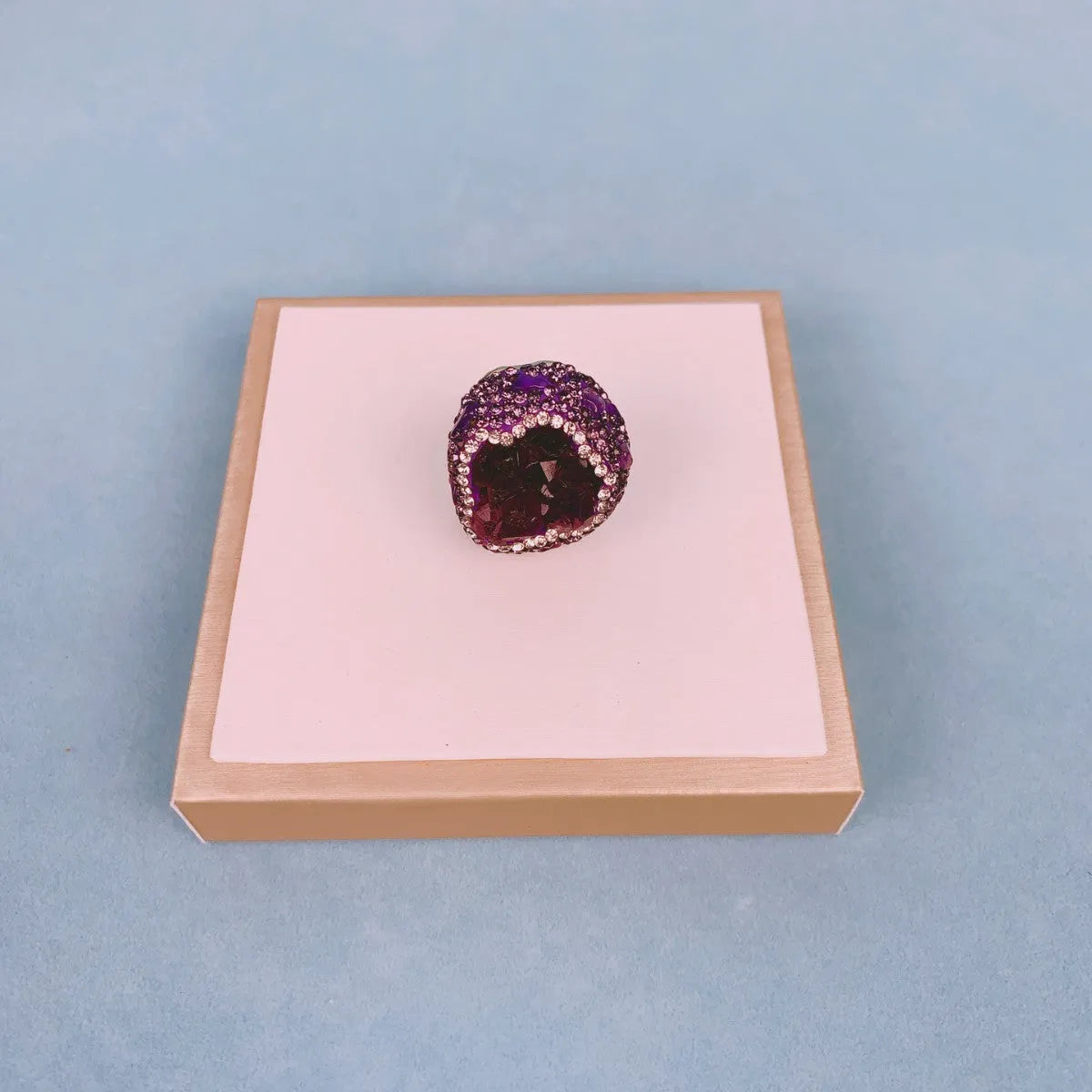 Natural Uruguay amethyst open adjustable ring in deep purple colour on a clean background