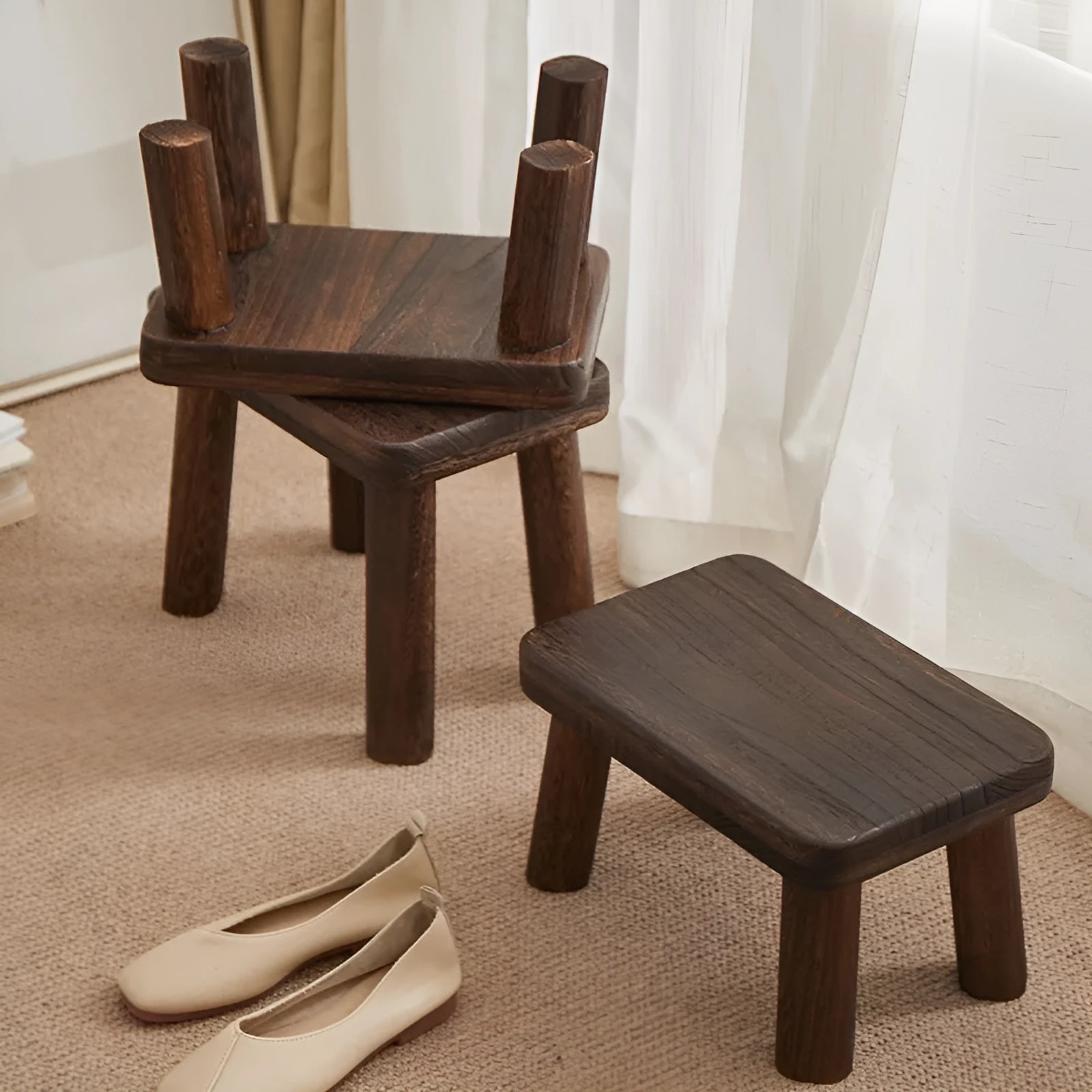 Solid wood distressed finish shoe changing stool with bracket legs.