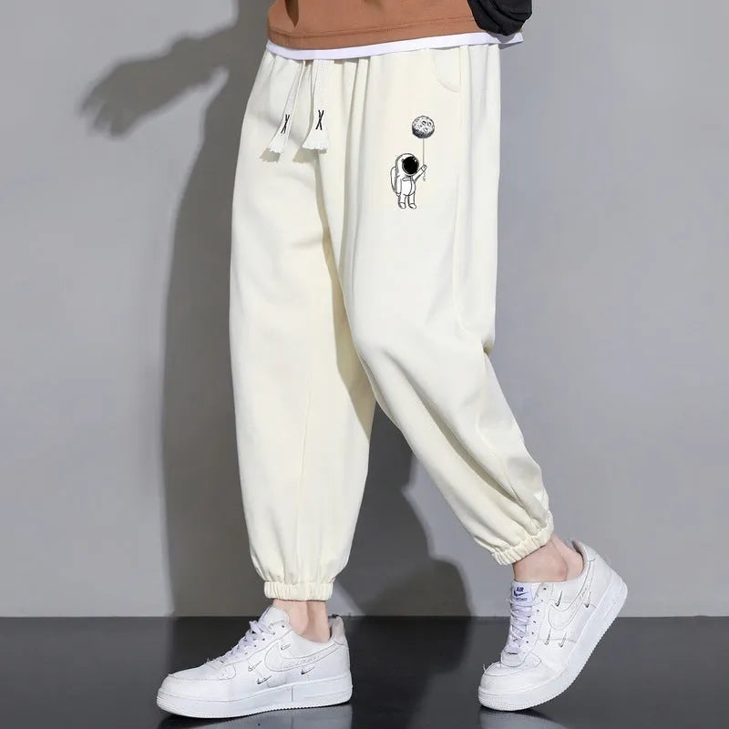 Cropped casual loose men's long pants in 100% polyester, tapered leg, mid waist, available in multiple colours