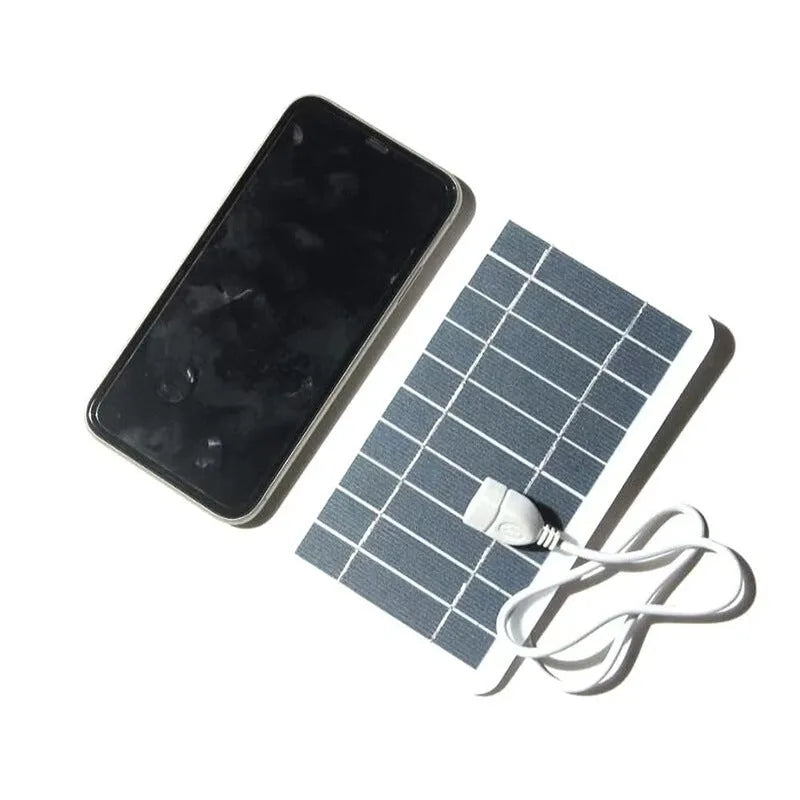2W 5V portable solar panel charger with USB cable showing 157mm by 94mm dimensions