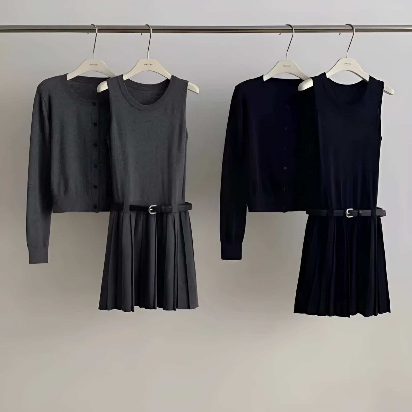 Women's grey art retro knitted two-piece set with pleated vest skirt, belt, and long sleeve cardigan featuring a 3D pattern.