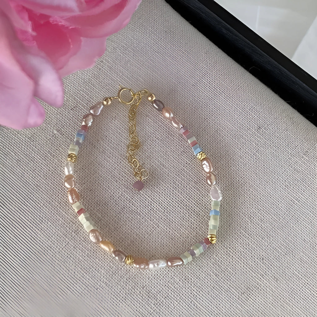 Natural silver pearl bracelet with 14K gilded purple finish and matching necklace on a U-shaped chain.