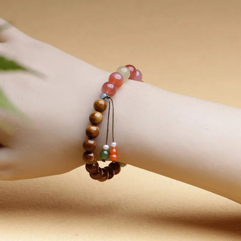 Women's 8mm diamond-shaped agate and Hetian jade bracelet with persimmon details.