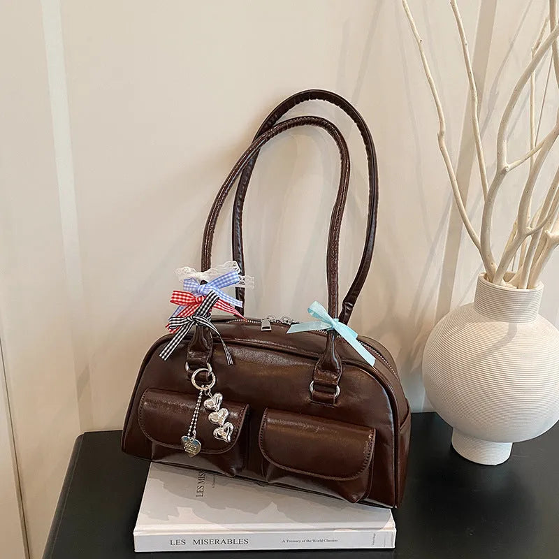 Retro style women's PU leather pillow bag with double shoulder strap in black colour