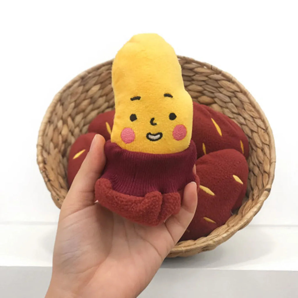 Red sweet potato shaped pet puzzle toy with hidden treat compartment and amusing face expression