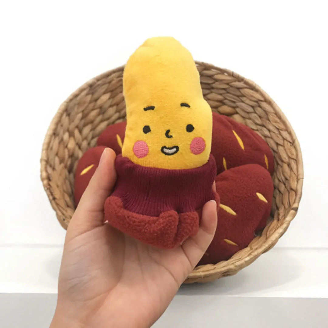 Red sweet potato shaped pet puzzle toy with hidden treat compartment and amusing face expression
