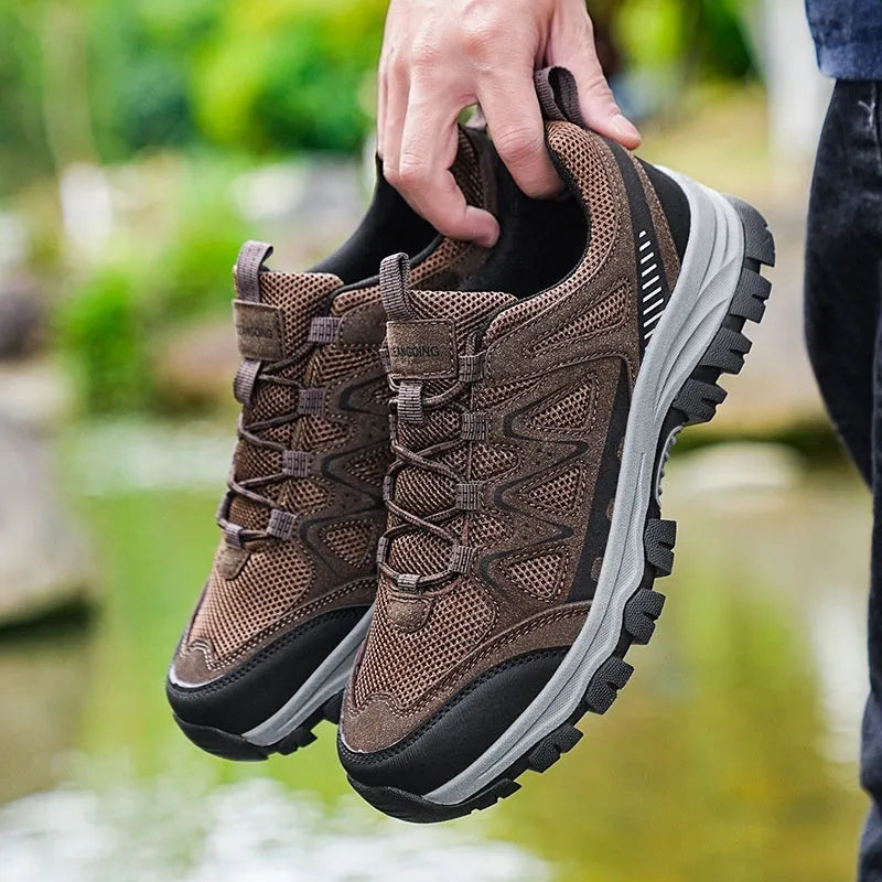 Men's black hiking shoes with low heel, breathable microfiber upper, and wear-resistant sole for camping and running