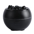 White round ultrasonic aroma diffuser humidifier with timer buttons on a desk.