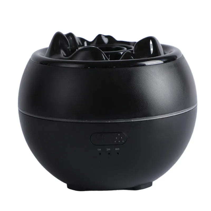 White round ultrasonic aroma diffuser humidifier with timer buttons on a desk.