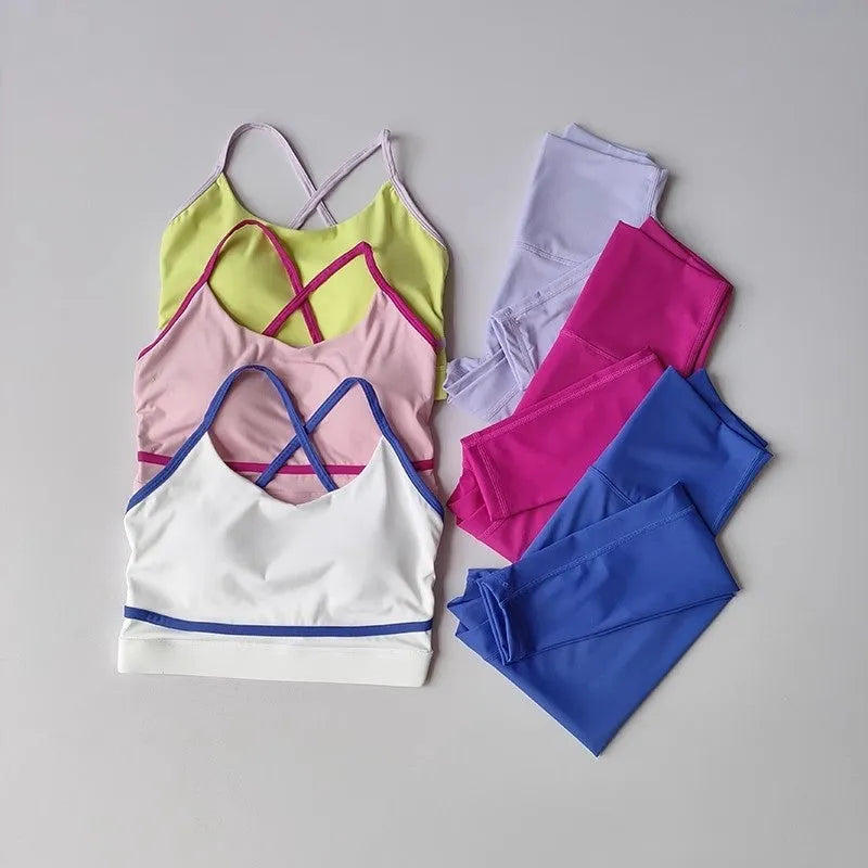 Women's blue and white quick-drying nylon spandex yoga pants and sleeveless tank top set.