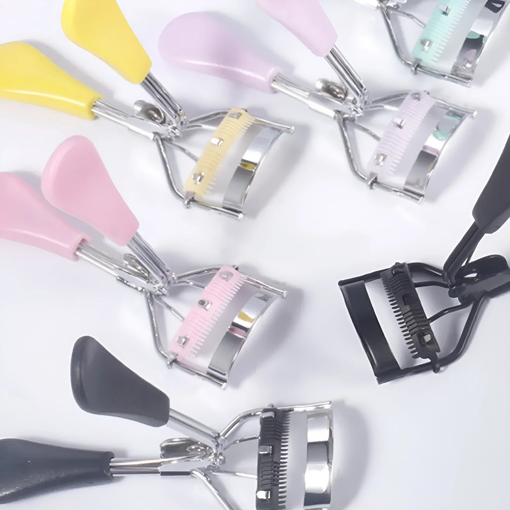 A4 manual eyelash curler with ribbon comb in choice of six colours including black, pink and purple