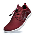 Men's black cloth casual shoes with soft sole and round wide toe on a solid background