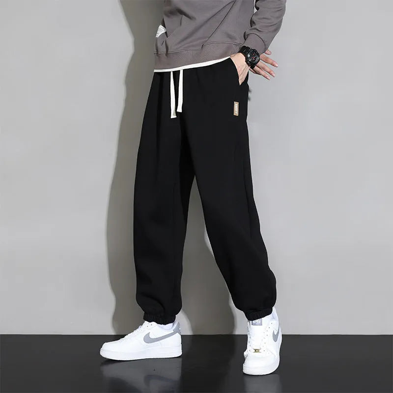 Men's loose grey sports trousers with drawstring waist in cotton-polyester blend