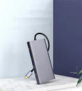 10-in-1 USB C docking hub and portable PD power bank compatible with Apple MacBook and iPhone.