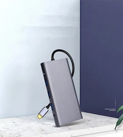 10-in-1 USB C docking hub and portable PD power bank compatible with Apple MacBook and iPhone.