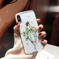 Handmade clear iPhone case with preserved dried flowers in epoxy resin sealing