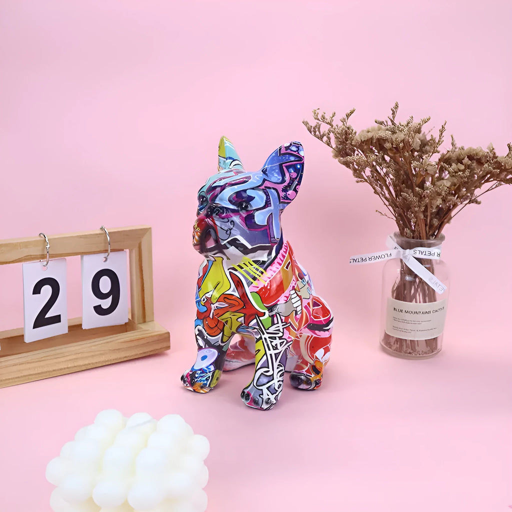 Graffiti-coloured French Bulldog resin statue on display surface