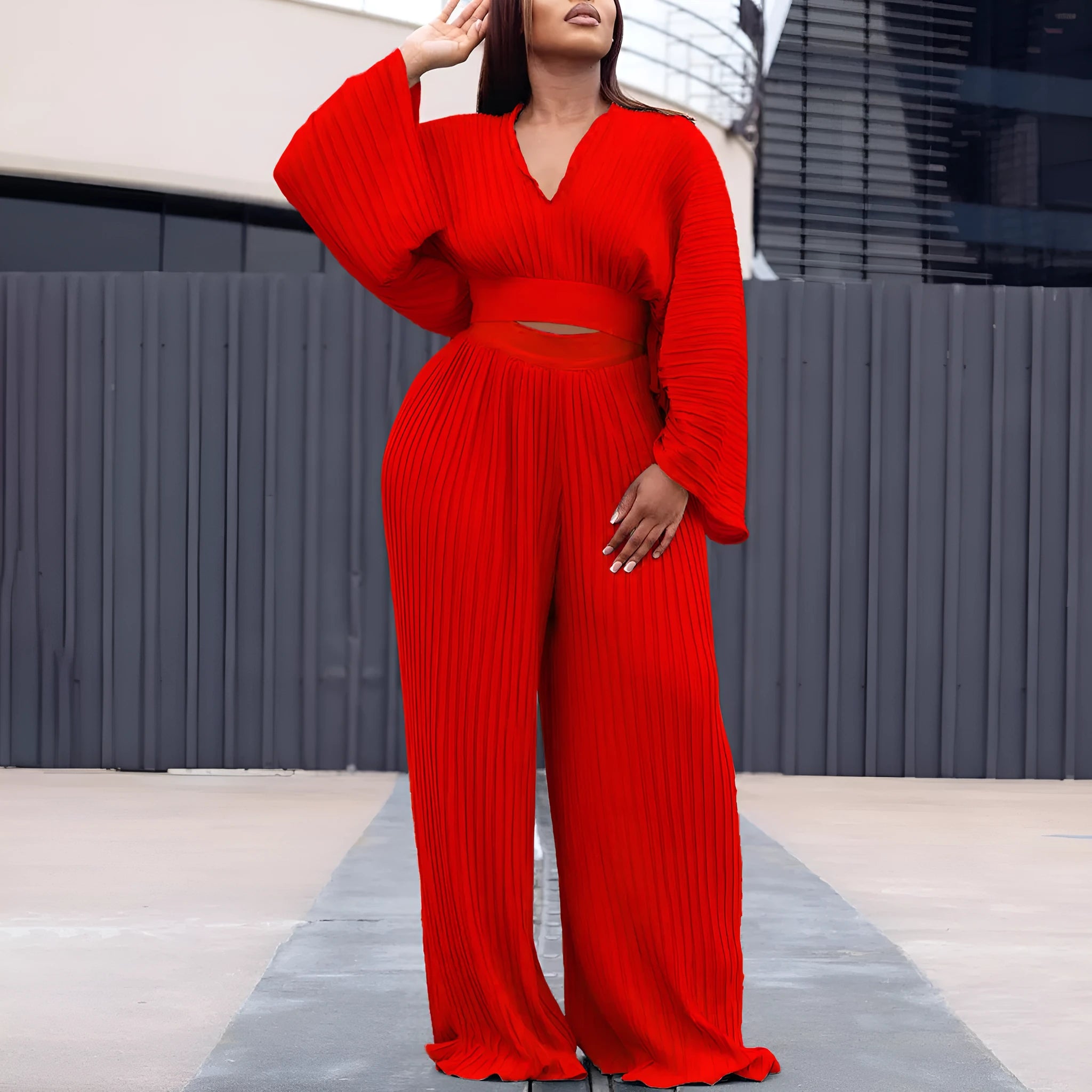 African suit two-piece set with batwing sleeve top and wide leg trousers in red or blue.