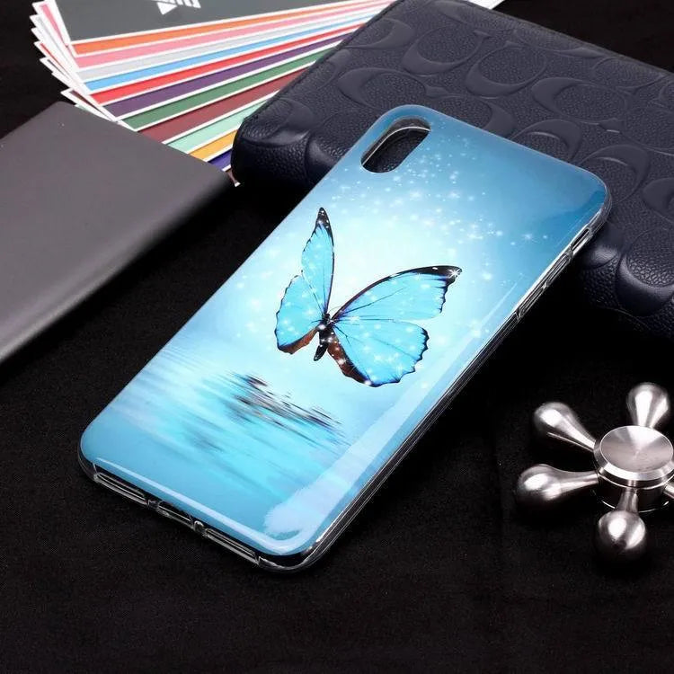 Luminous glow-in-the-dark TPU iPhone case with a cartoon butterfly design on the back.