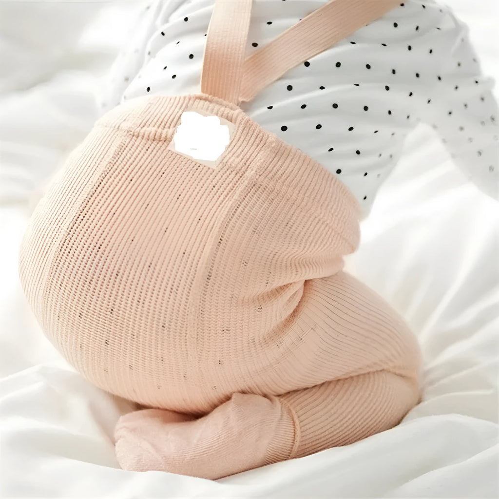 Combed cotton baby crawling cross overalls in pink with high-waist design