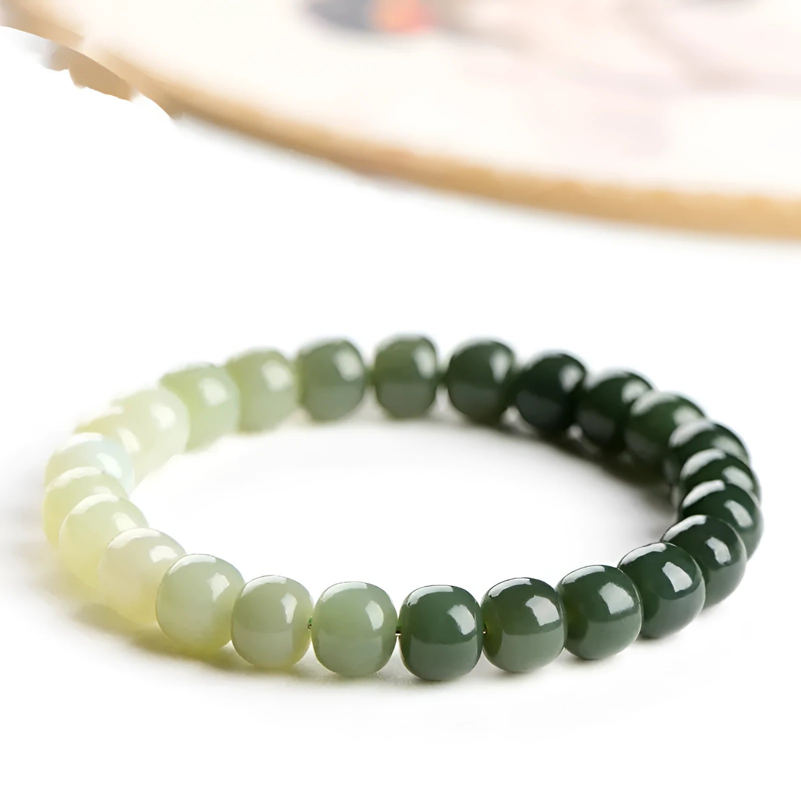 Hetian Jade bracelet with water gradient colour on polished beads.