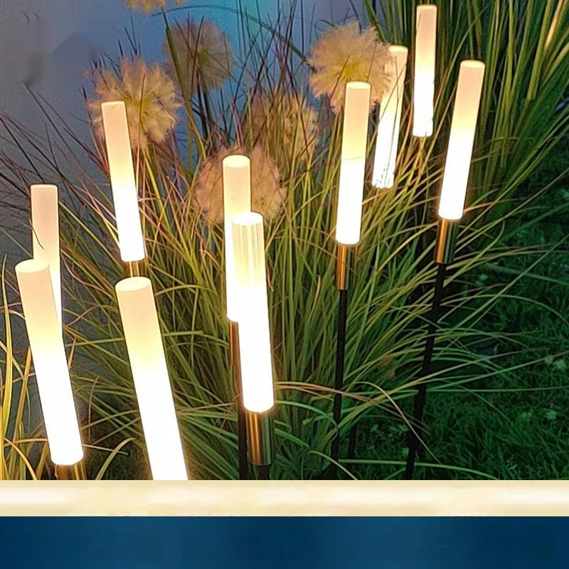 Solar outdoor LED lawn lamp with acrylic shade, available in multiple heights, installed in a garden.