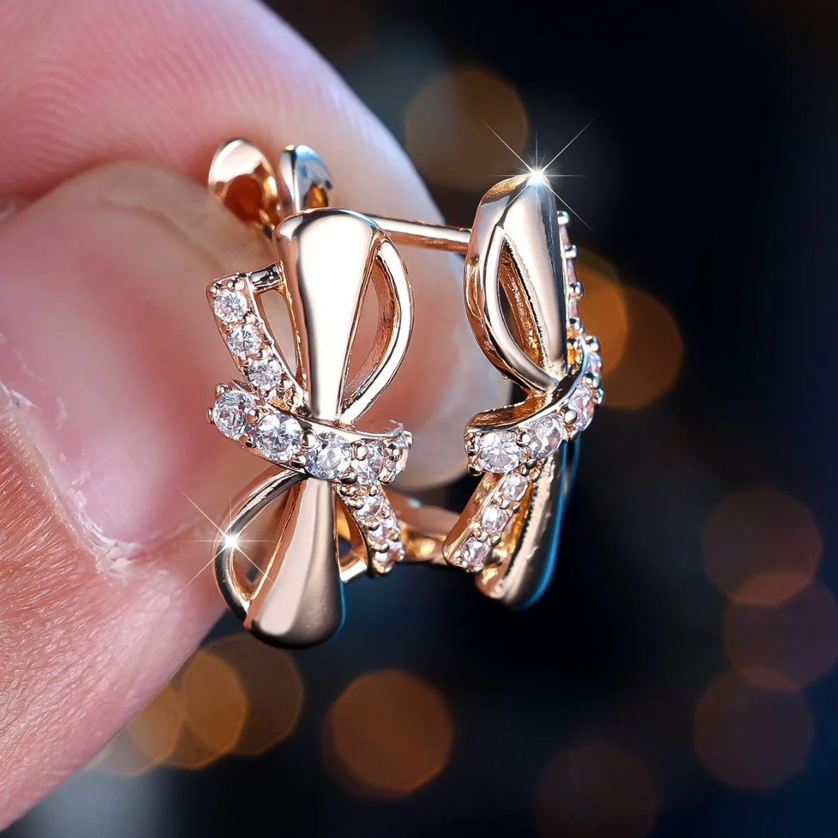 Champagne gold copper ear clip with white diamonds in fine bends and hitches design for women