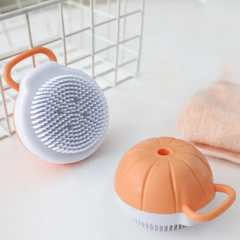 Orange TPR dog bath brush with shampoo dispenser and pumpkin-shaped grip