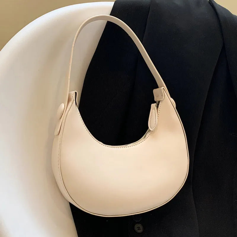 Retro dumpling-shaped women's shoulder bag in PU, shown in cream yellow, with dimensions 21x20x6cm.