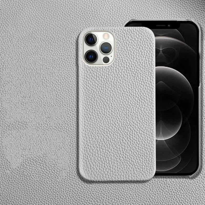 Genuine brown cowhide leather iPhone case with simple half line design on an iPhone 14 Pro Max.