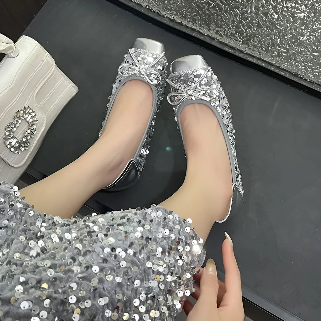 Women's black satin Mary Jane pump with height increasing insole, rhinestones, buckle, and square toe