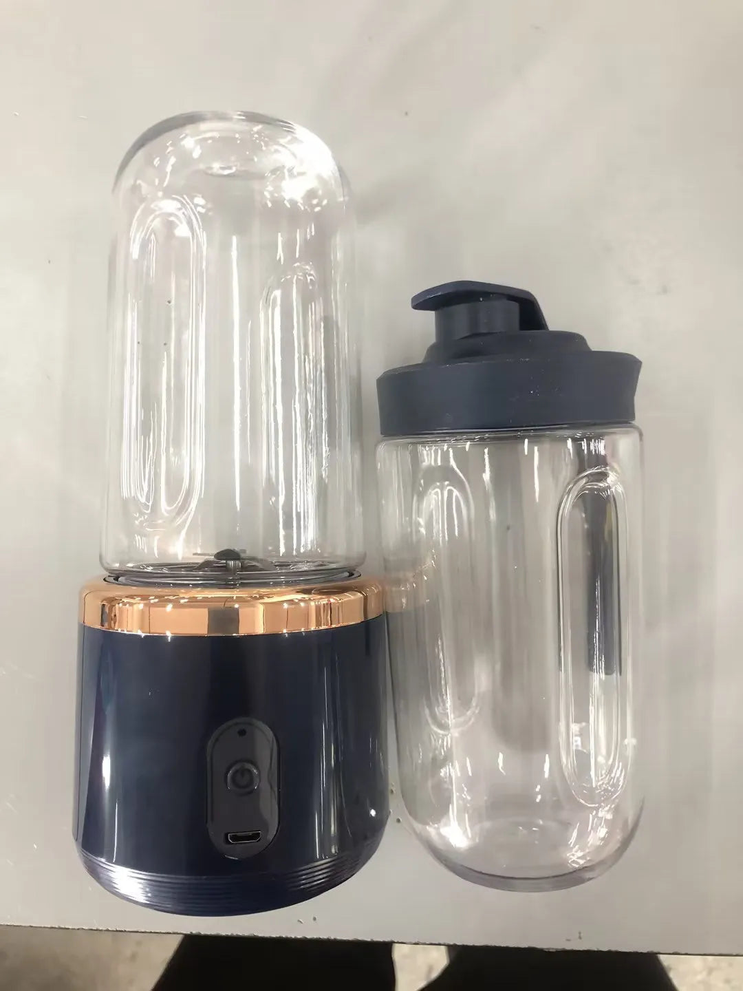 Tunisian dark blue portable USB blender with cup lid, showing compact size and 6-blade design