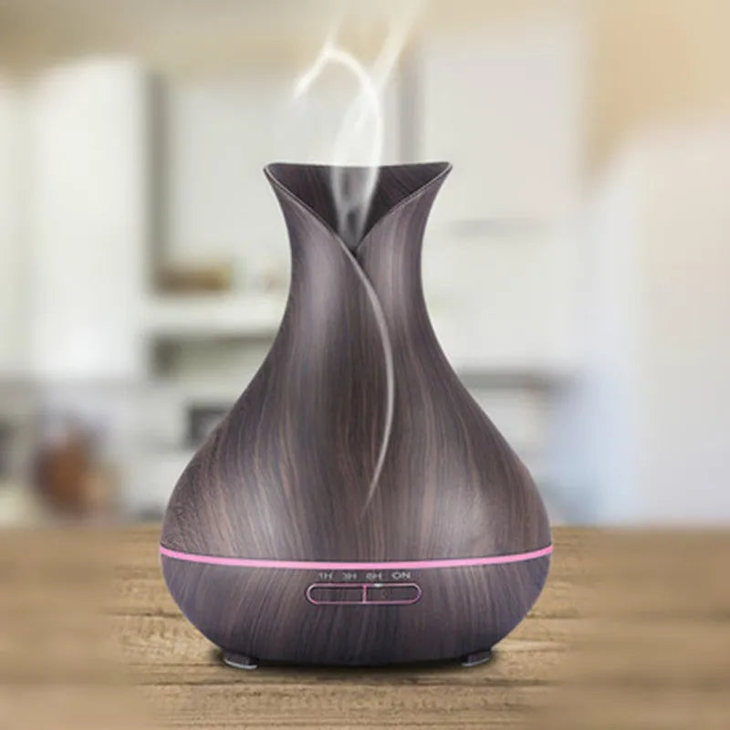 Ultrasonic aroma diffuser with 400ml capacity, dark wood finish, and 7 LED colour light display