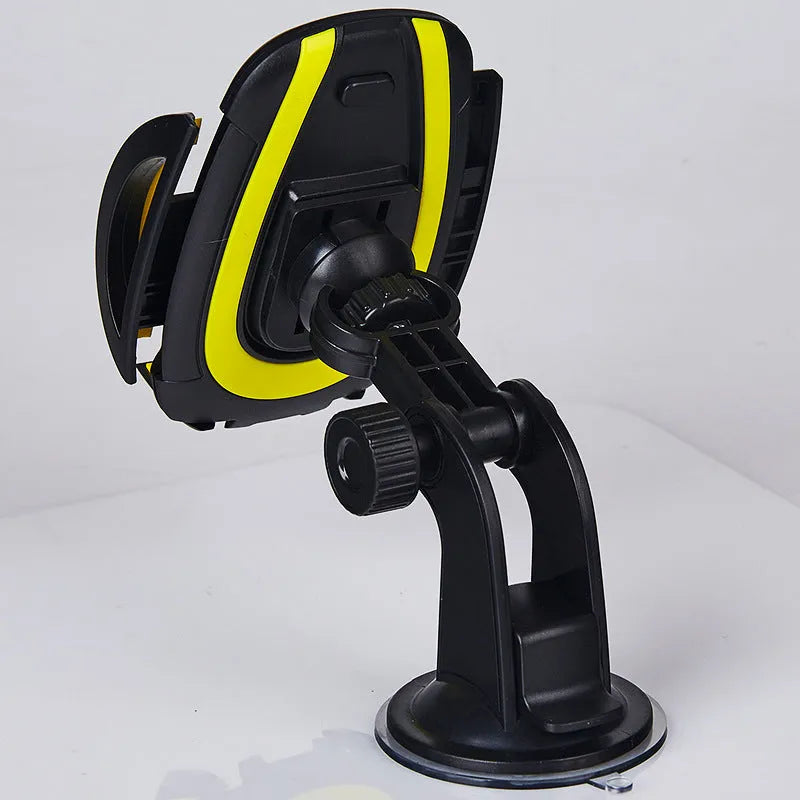 Red ABS suction cup U-shaped mobile phone bracket with open clamp arms on a car dashboard.