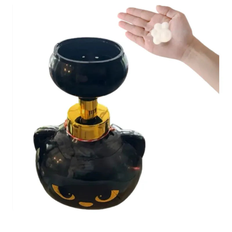 Black plastic cartoon cat-shaped soap extrusion dispenser accessory on countertop