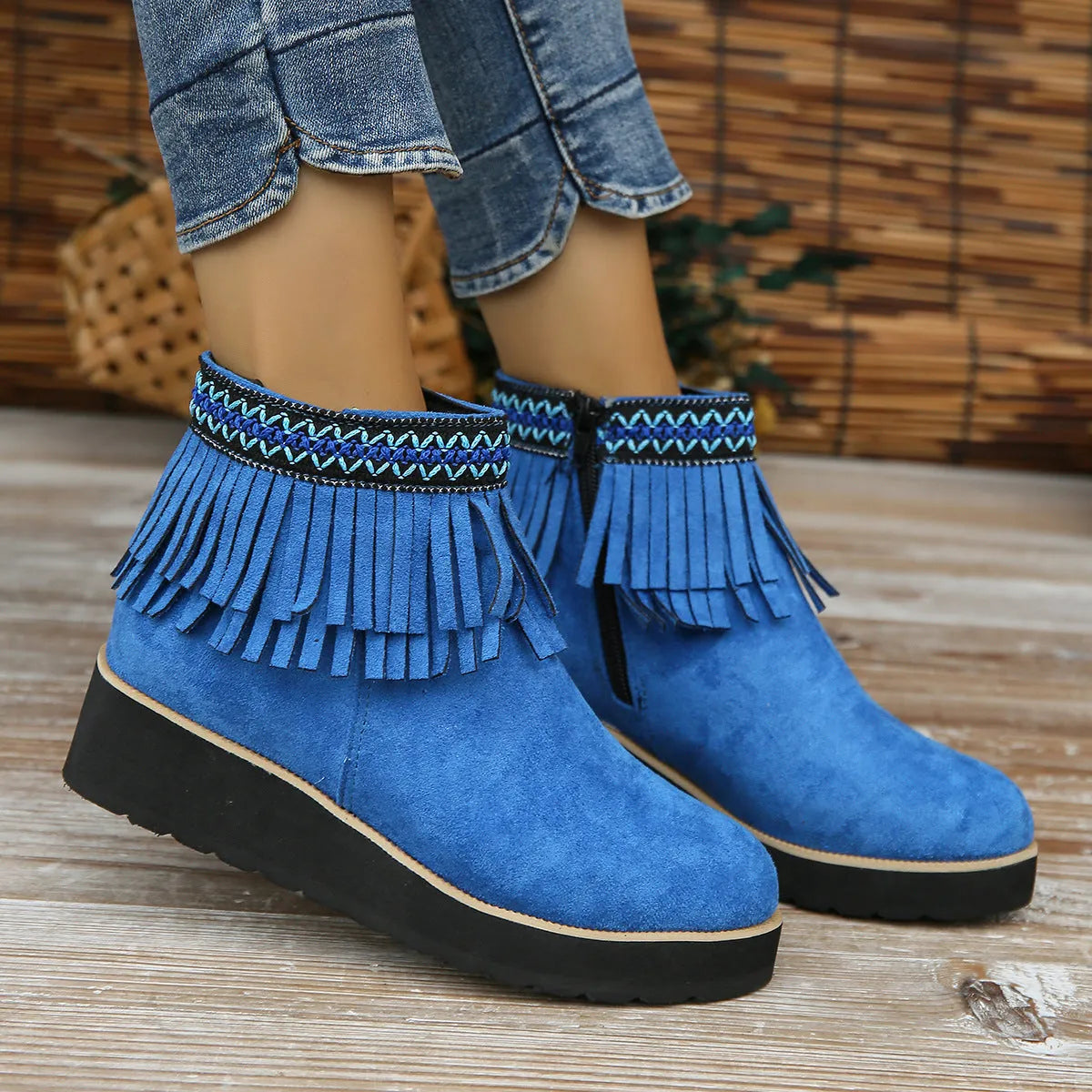 Women's suede wedge ankle boots in dark brown with a side zipper and thick rubber sole.