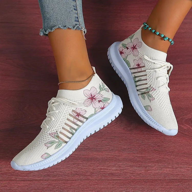 White women's mesh knit running shoes with round toe and flat rubber sole