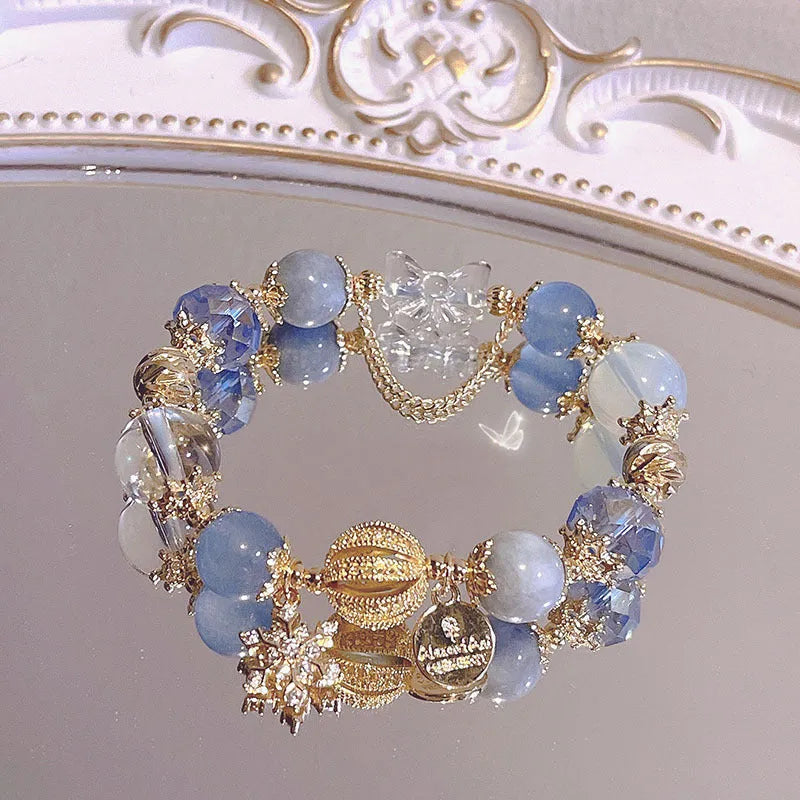 Women's galaxy-coloured alloy bracelet with bow and snowflake pendant charm
