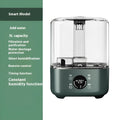 Green KC-112 touch screen humidifier with remote control on a table.