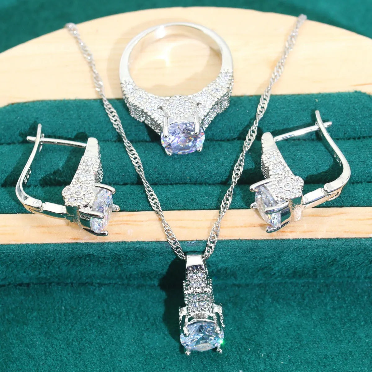 Bridal zircon jewellery four-piece set showing necklace, earrings, bracelet and ring with water wave chain