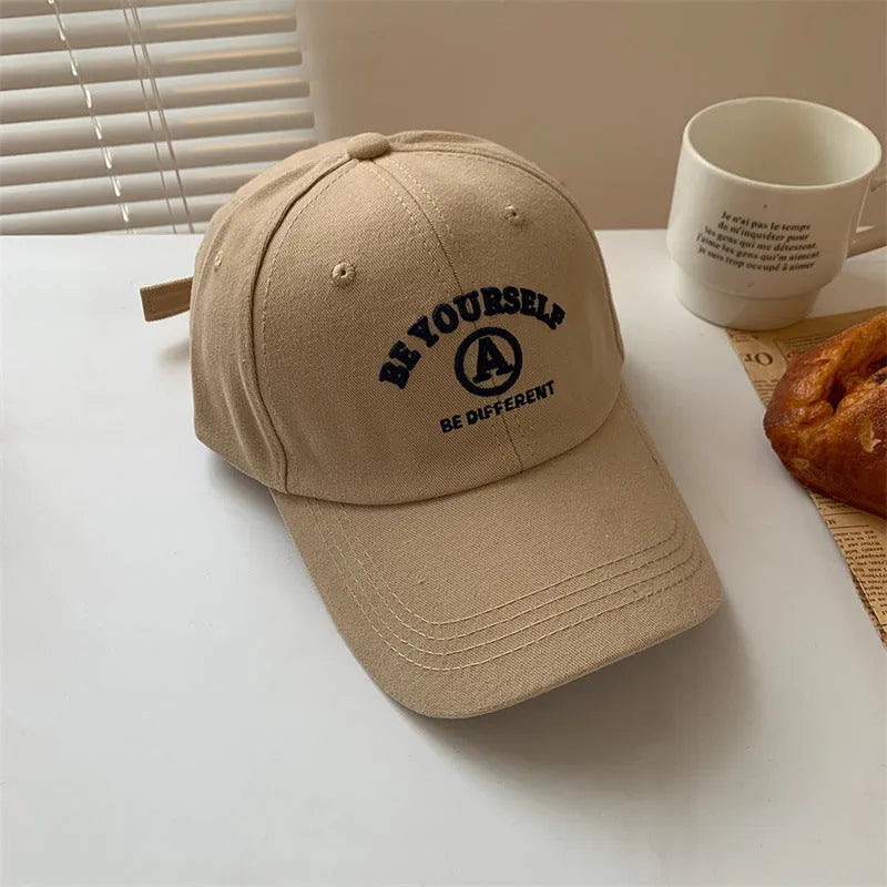 Cotton baseball cap with embroidered couple face, adjustable head circumference, available in six colours