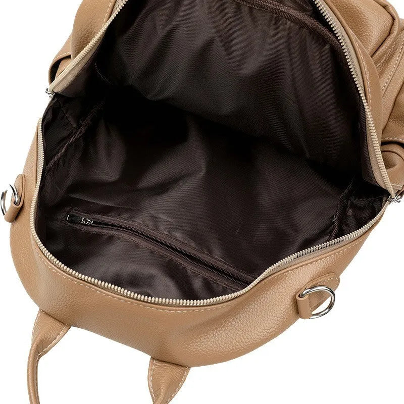 Genuine leather hand-held tassel backpack in khaki with stitching and fringe detail