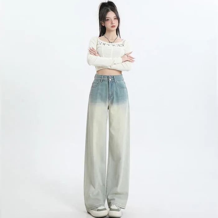 Women's gradient blue straight-leg denim trousers on a hanger.