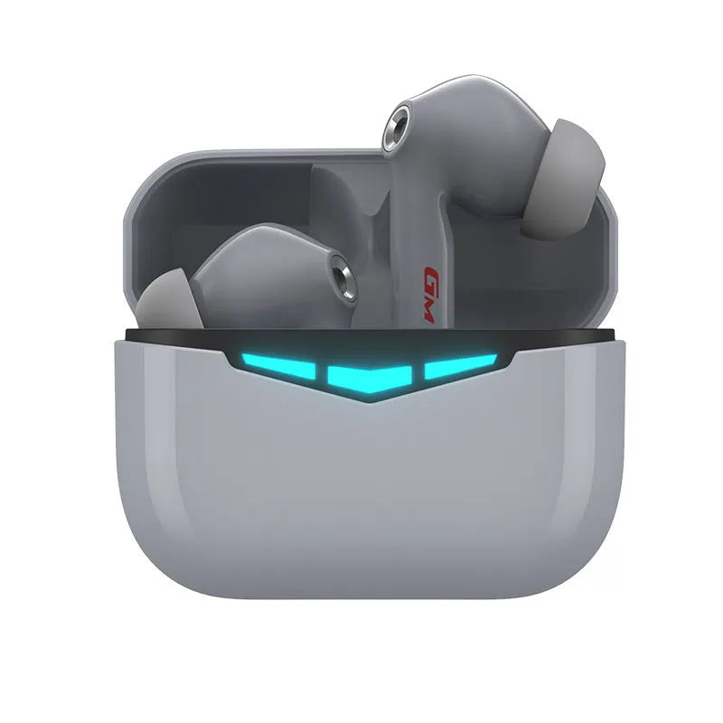 Black true wireless gaming earbuds and charging case on a dark surface, showing in-ear design.