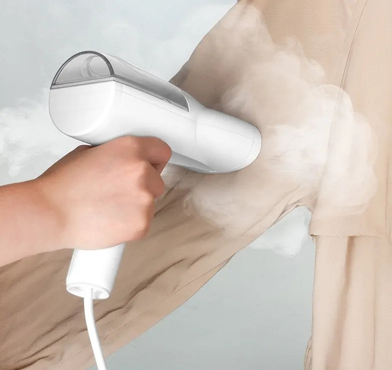 White folding ironing machine with 800W steam, measuring 10x6.2x18cm folded, on a plain background