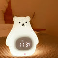Big White Bear shaped silicone night light with remote control on a wooden bedside table