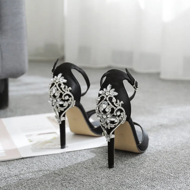 Black suede women's high heel shoes with rhinestone details on a 6-8cm heel.