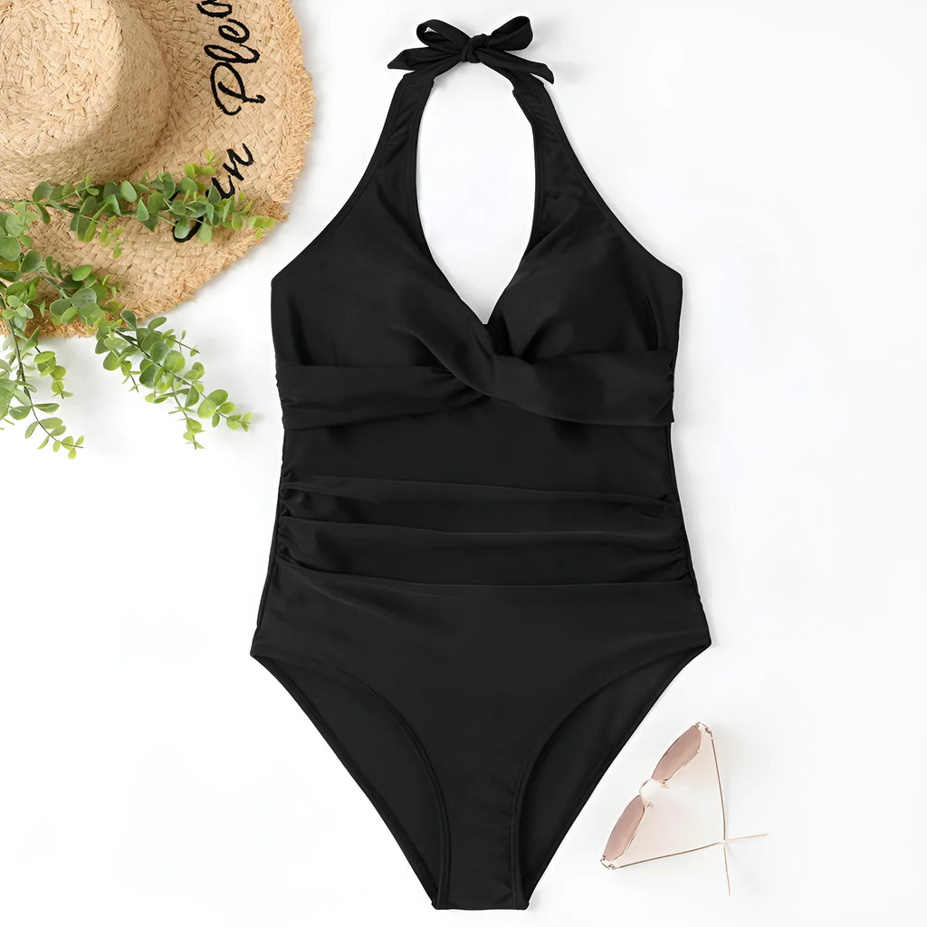 Women's solid colour cross-front one-piece swimsuit in polyester on a mannequin.